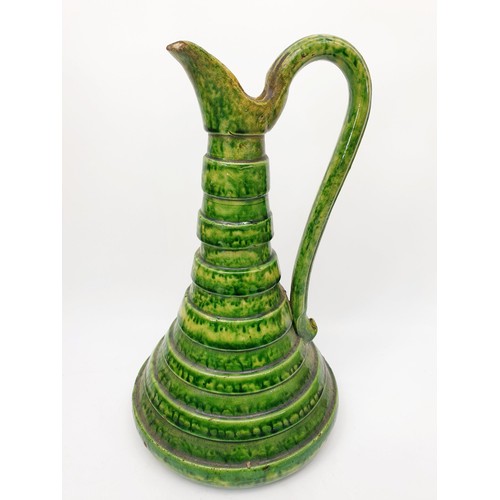 281 - An antique majolica jug, A/F, height 10.5