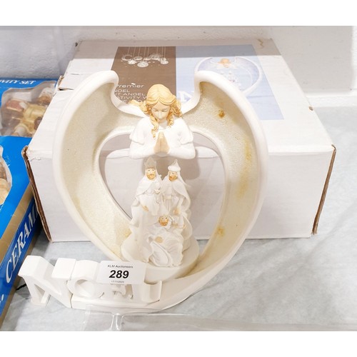 289 - A boxed ceramic Nativity set together with a Christmas ornament. No shipping. Arrange collection or ... 