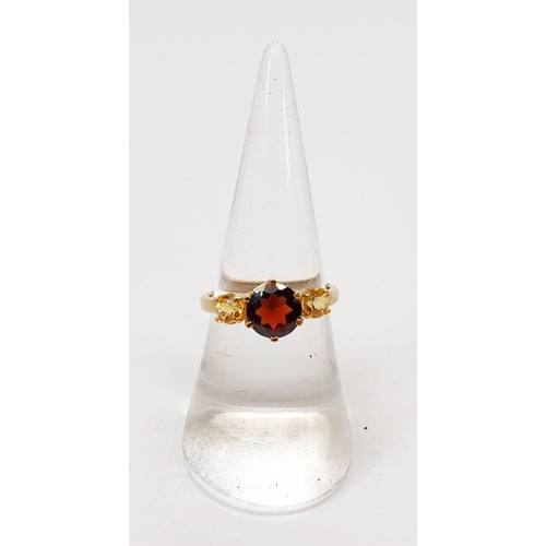 6 - A hallmarked 9ct gold garnet and citrine ring, size N/O, gross weight 2.4g. UK shipping £14. We comb... 