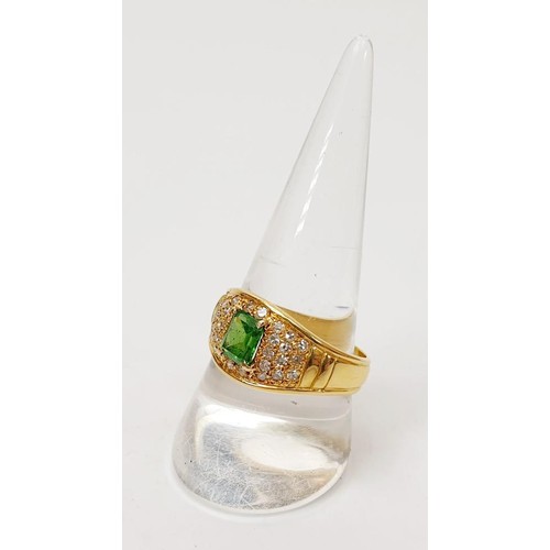 11 - An 18ct gold diamond and emerald ring, size T/U, gross weight 7.7g. UK shipping £14. We combine ship... 