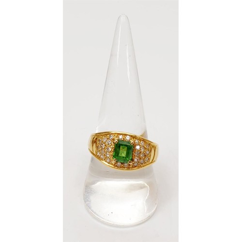 11 - An 18ct gold diamond and emerald ring, size T/U, gross weight 7.7g. UK shipping £14. We combine ship... 