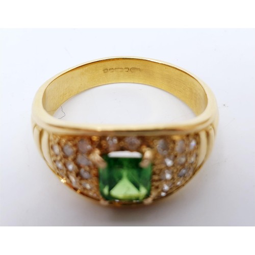 11 - An 18ct gold diamond and emerald ring, size T/U, gross weight 7.7g. UK shipping £14. We combine ship... 