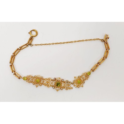 38 - An Edwardian 9ct gold bracelet set with peridot and pearl, A/F, length 6.75