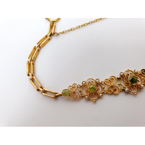 38 - An Edwardian 9ct gold bracelet set with peridot and pearl, A/F, length 6.75