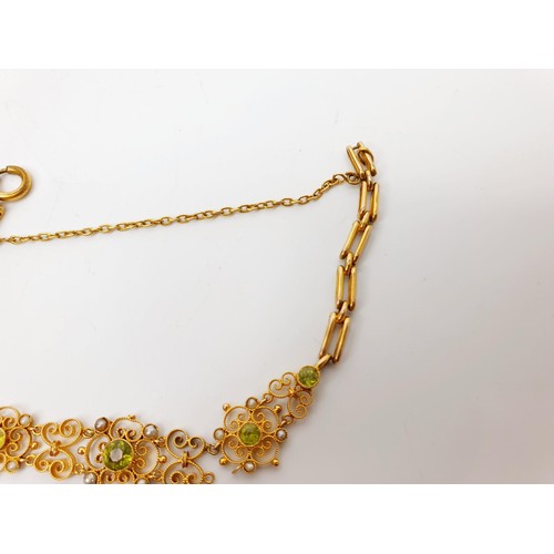 38 - An Edwardian 9ct gold bracelet set with peridot and pearl, A/F, length 6.75