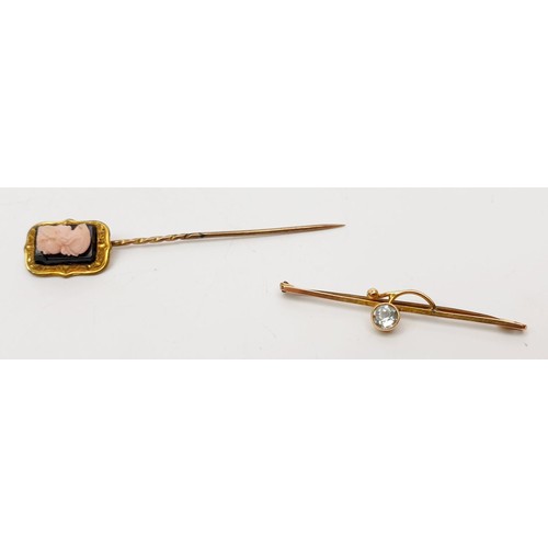 47 - A 9ct bar brooch set with a white stone, gross weight 1.2g together with an antique gold plated stic... 