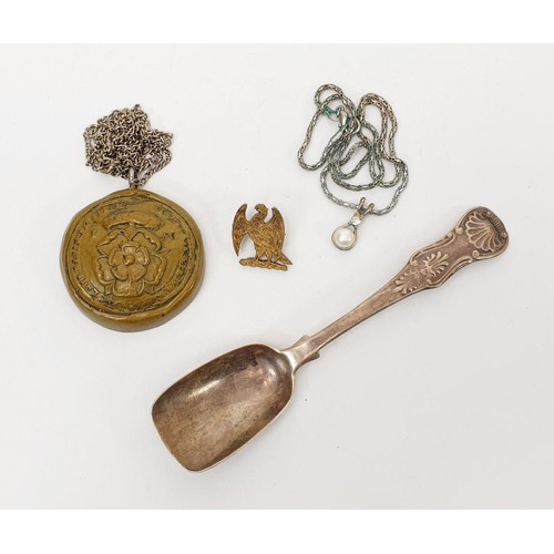 67 - A Georgian silver hallmarked shovel spoon, weight 25g, London 1797 together with a silver gilt badge... 