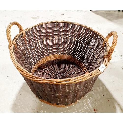 198 - A wicker log basket, diameter 21