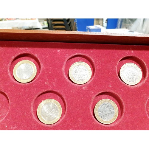 205 - A coin collector's case containing twenty eight collectable £2 coins and other coins. UK shipping £1... 