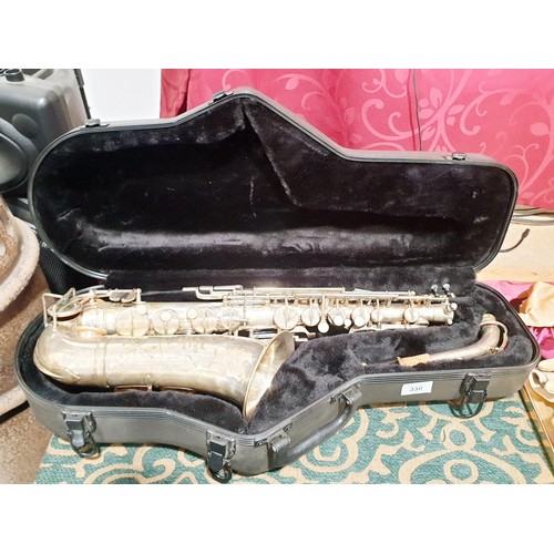 330 - A saxophone inscribed Rene Guenot A. Douchet of Paris with hard case. No Shipping. Arrange collectio... 