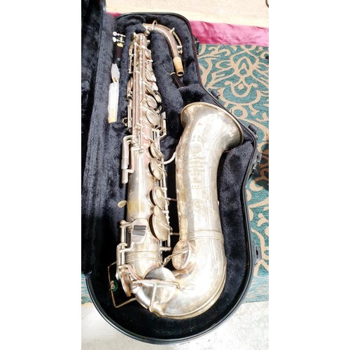 330 - A saxophone inscribed Rene Guenot A. Douchet of Paris with hard case. No Shipping. Arrange collectio... 