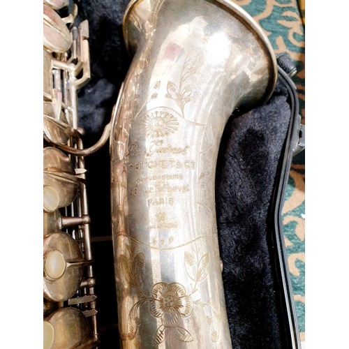 330 - A saxophone inscribed Rene Guenot A. Douchet of Paris with hard case. No Shipping. Arrange collectio... 