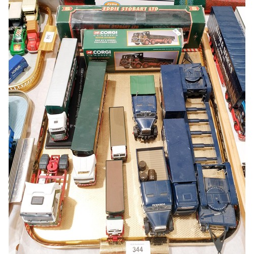 344 - A selection of loose and boxed model trucks. UK shipping £14.