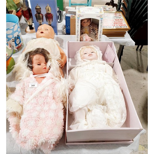 349 - A boxed Leonardo Collection porcelain doll, length 20