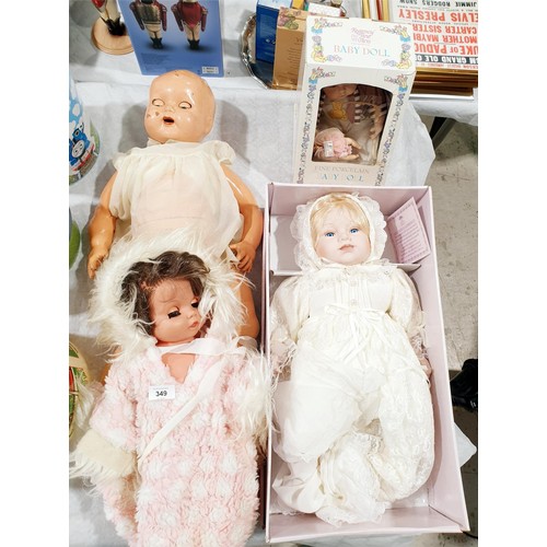 349 - A boxed Leonardo Collection porcelain doll, length 20