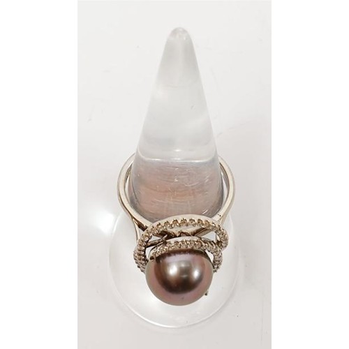 10 - A hallmarked 18ct white gold ring set with a Tahitian pearl and diamond retailed by Ogden's Jeweller... 