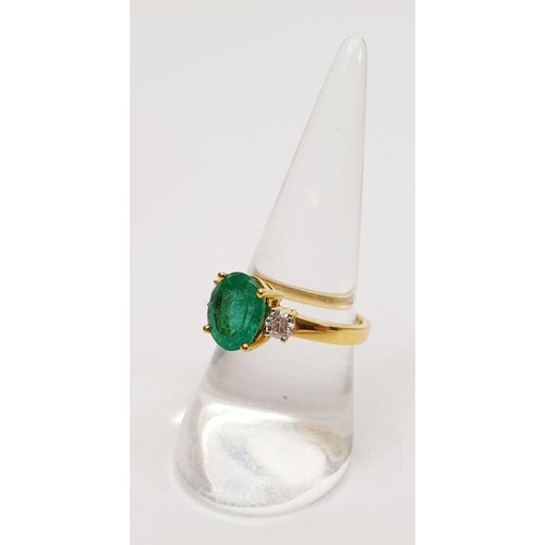 11 - An 18ct emerald and diamond three stone ring, size O/P, gross weight 4.7g. UK shipping £14. We combi... 