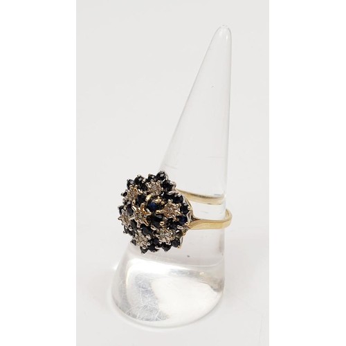 14 - A 9ct gold diamond and sapphire cluster ring, size Q, gross weight 4.3g. UK shipping £14. We combine... 