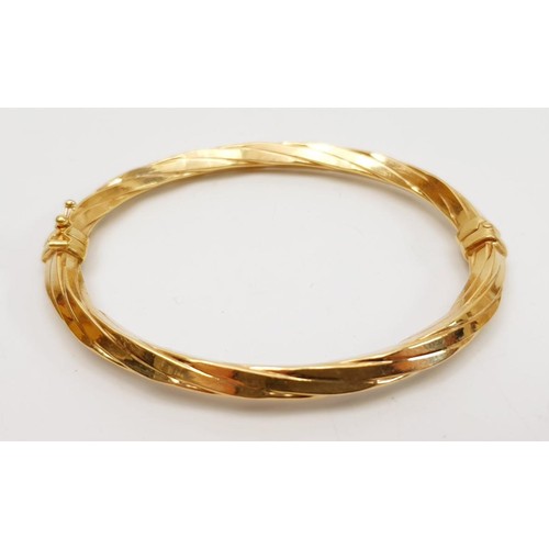 17 - A 9ct gold bangle, weight 8.2g. UK shipping £14.  We combine lots.