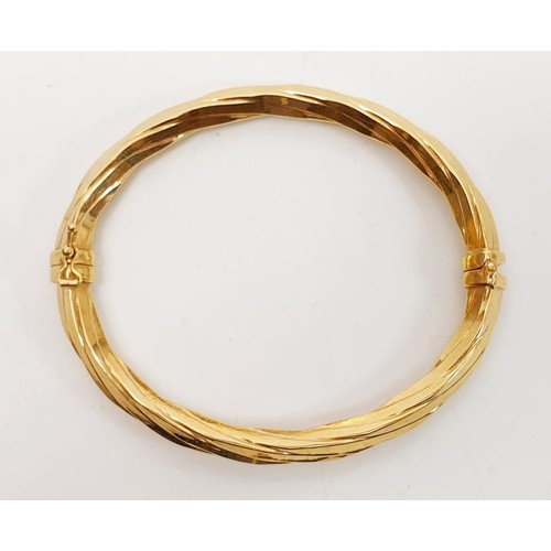 17 - A 9ct gold bangle, weight 8.2g. UK shipping £14.  We combine lots.