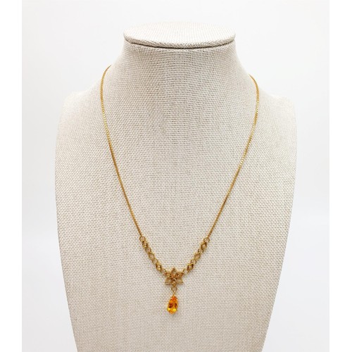 19 - An 18ct gold citrine and diamond set necklace, gross weight 6.8g. UK shipping £14. We combine lots.