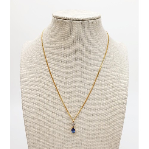 20 - An 18ct gold sapphire and diamond set pendant, on a 18ct gold chain, chain length 16