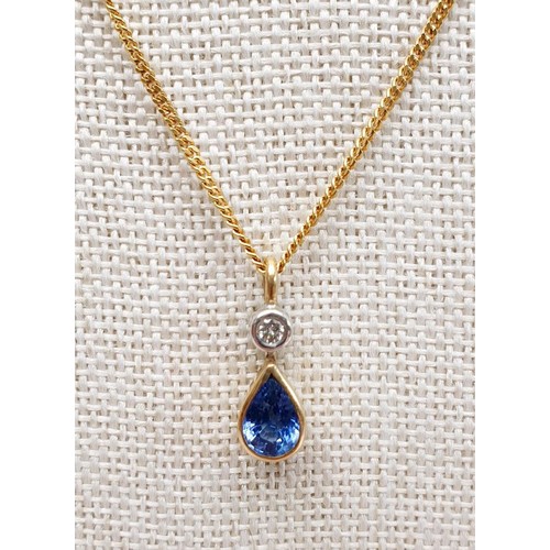 20 - An 18ct gold sapphire and diamond set pendant, on a 18ct gold chain, chain length 16