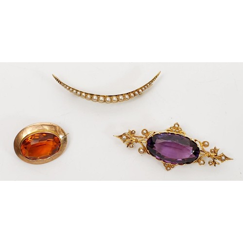 29 - A yellow metal crescent brooch set with pearls, a yellow metal brooch set with amethyst and pearl an... 