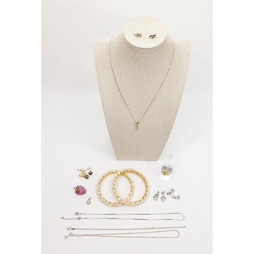 3 - A hallmarked 9ct gold pendant and earring set, each set with a white stone on a 9ct gold chain, gros... 