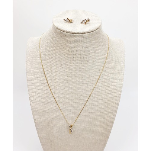 3 - A hallmarked 9ct gold pendant and earring set, each set with a white stone on a 9ct gold chain, gros... 