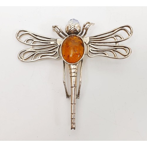 34 - A silver brooch in form of a dragonfly set with amber and crystal, length 3