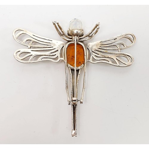 34 - A silver brooch in form of a dragonfly set with amber and crystal, length 3