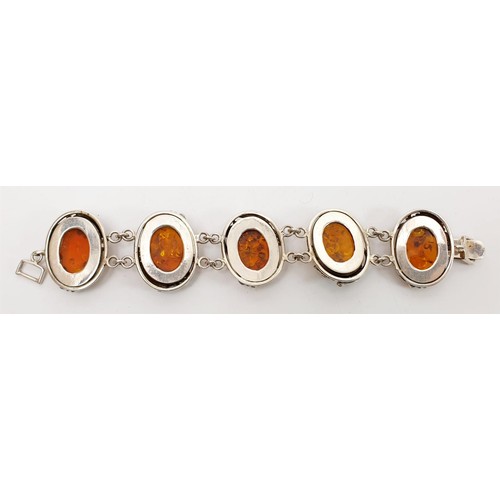 36 - A silver and amber bracelet, length 8