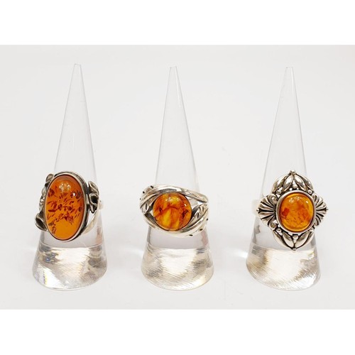 37 - Three silver and amber set rings, gross weight 22g. UK shipping £14. We combine lots.