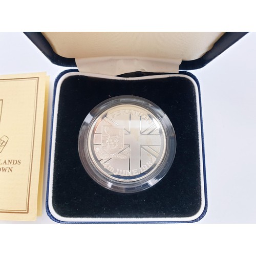 64 - A boxed 1982 The Falkland Islands Liberation silver proof crown. UK shipping £14. We combine lots.