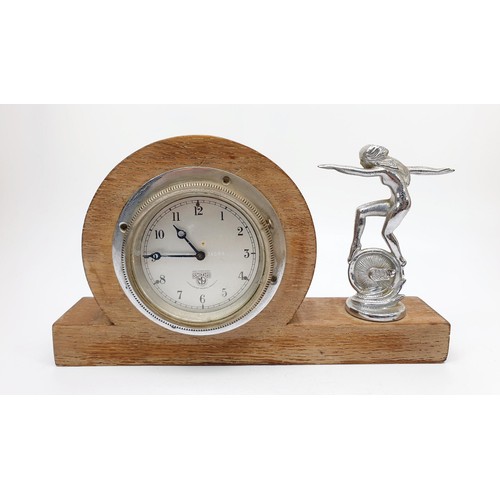 323 - A vintage Crossley car mascot together with a Smith's hinged car clock in a homemade mount, height 5... 