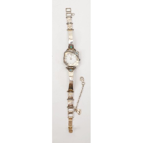 56 - A ladies silver quartz wrist watch. UK shipping £14. We combine lots.