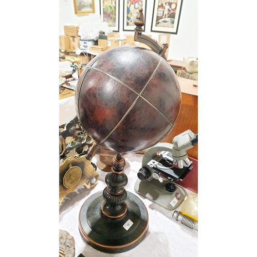 72 - A leather globe, height 28