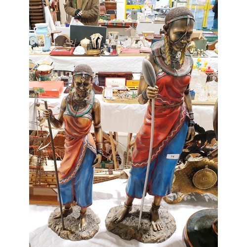 74 - A pair of resin African figures, the tallest 30