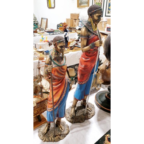 74 - A pair of resin African figures, the tallest 30