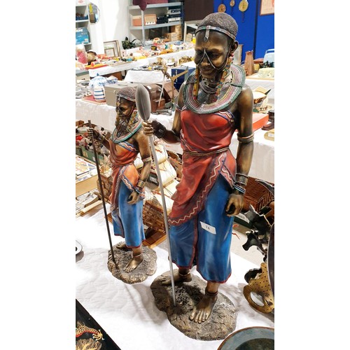 74 - A pair of resin African figures, the tallest 30