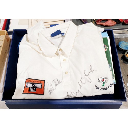 82 - A 2002 Yorkshire Cricket Club shirt signed by the players and dedicated to Craig White for his benef... 