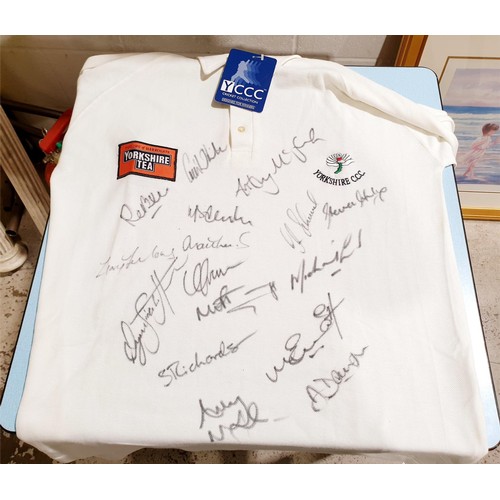 82 - A 2002 Yorkshire Cricket Club shirt signed by the players and dedicated to Craig White for his benef... 