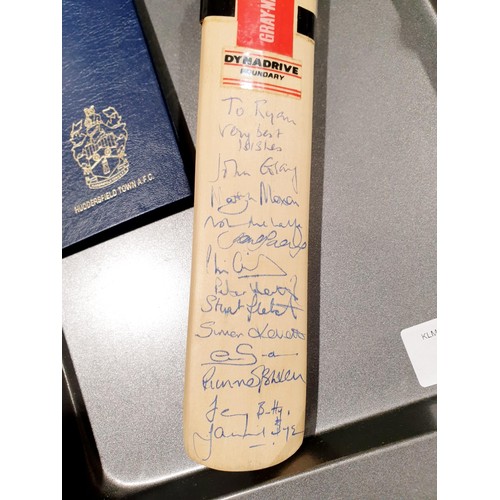 115 - A miniature cricket bat signed by England players including Martyn Moxon together with a Huddersfiel... 