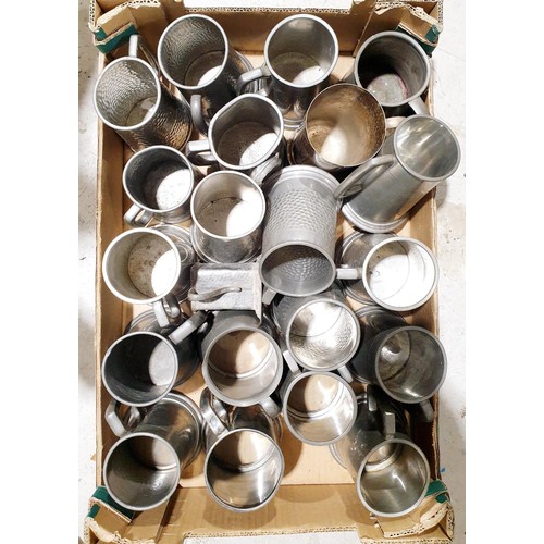 122 - A box of pewter tankards. UK shipping £14.