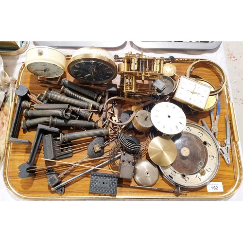 162 - A selection of clock parts and three alarm clocks including Swiza. UK shipping £14.