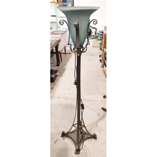 206 - A wrought iron and glass floor lamp, height 57.25