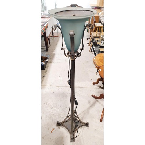 206 - A wrought iron and glass floor lamp, height 57.25