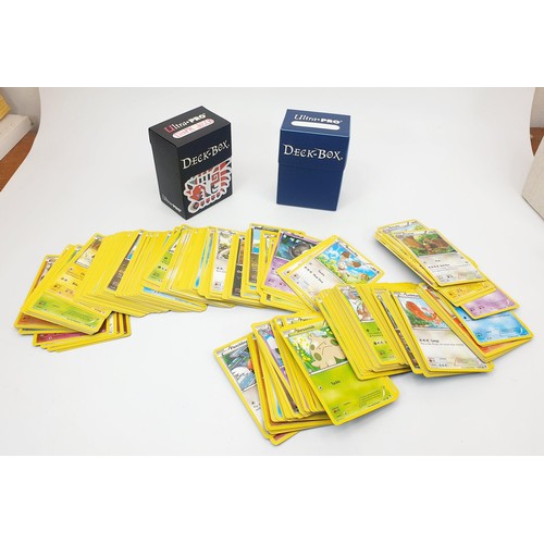 274 - Six boxes of Pokemon cards, some in top load sleeves, spare sleeves and dice. UK shipping £14.