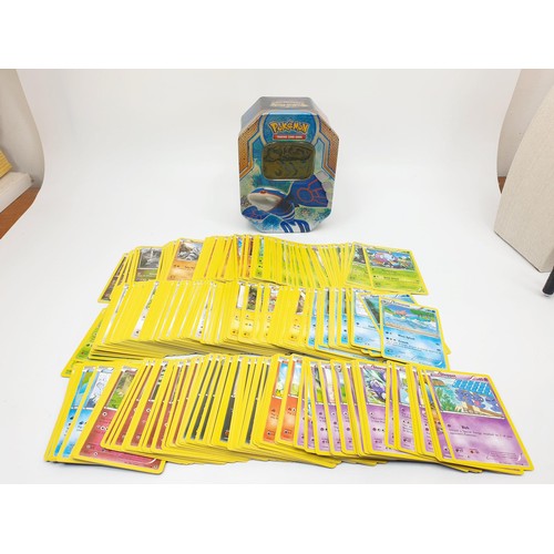 274 - Six boxes of Pokemon cards, some in top load sleeves, spare sleeves and dice. UK shipping £14.